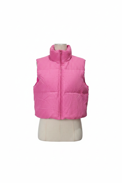 Ladies pink ribbed puffer vest cropped zip-up sleeveless white background