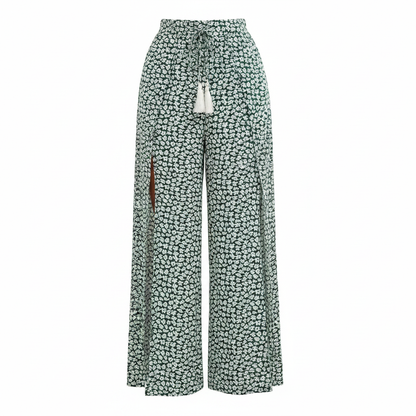 Dark green ditsy floral wide leg palazzo pants with white tassel knot tie on white background
